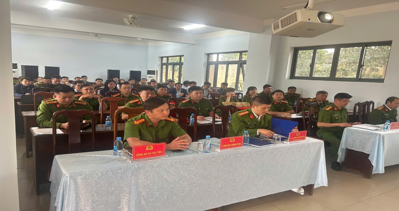 '''A group of people in military uniforms sitting at a table
 Description automatically generated'''