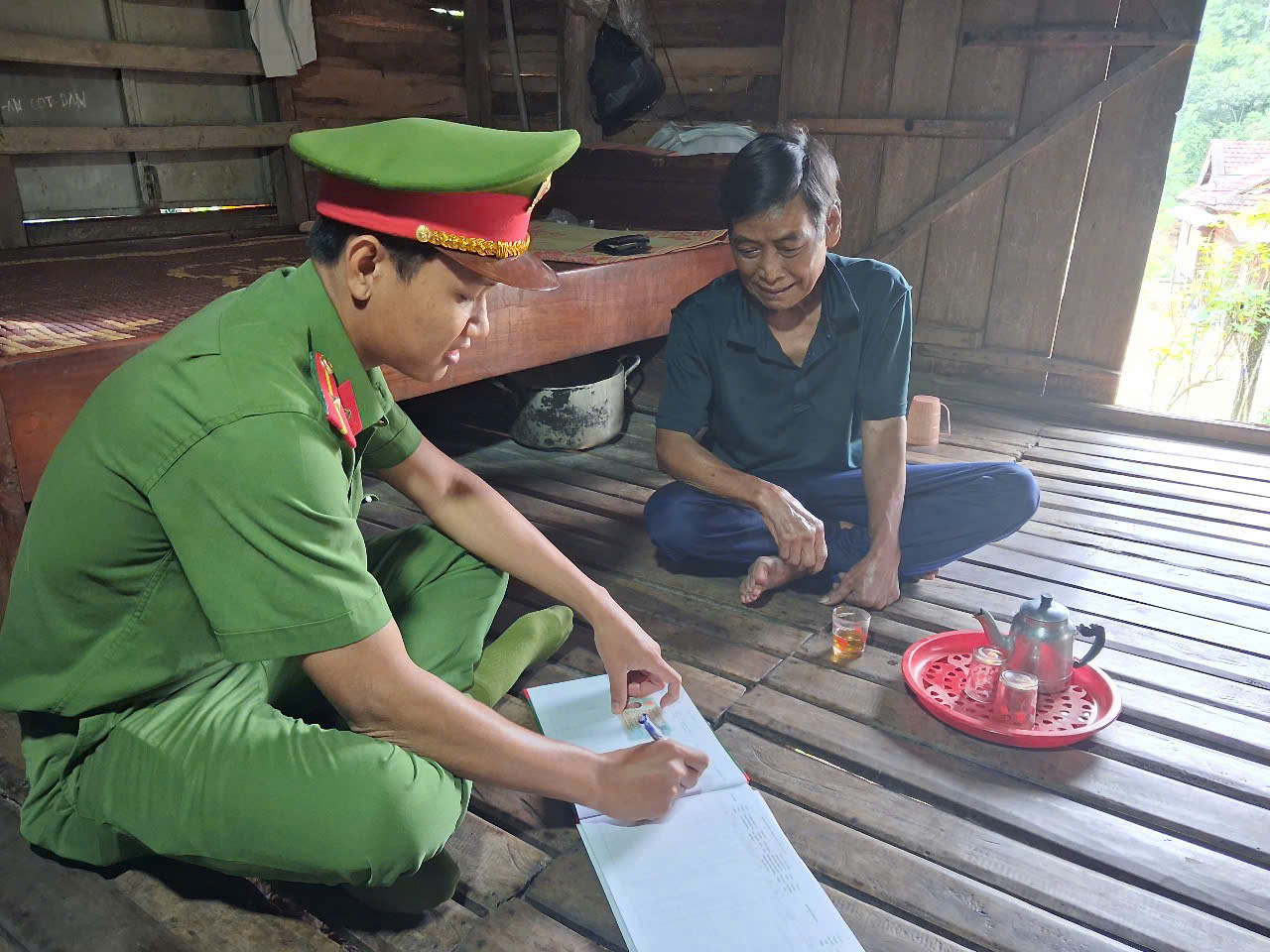 ''''A person in uniform writing on a piece of paper
AI-generated content may be incorrect.''''