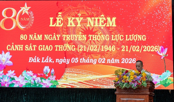 '''''A person standing at a podium with flowers
 AI-generated content may be incorrect.'''''