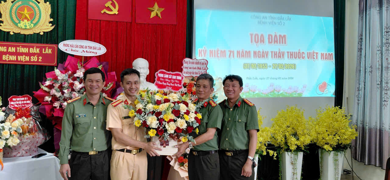 ''A group of people in uniform holding flowers

AI-generated content may be incorrect.''