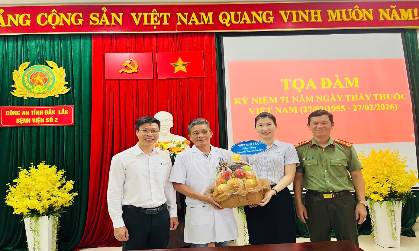 ''A group of people standing in front of a red and green curtain

AI-generated content may be incorrect.''