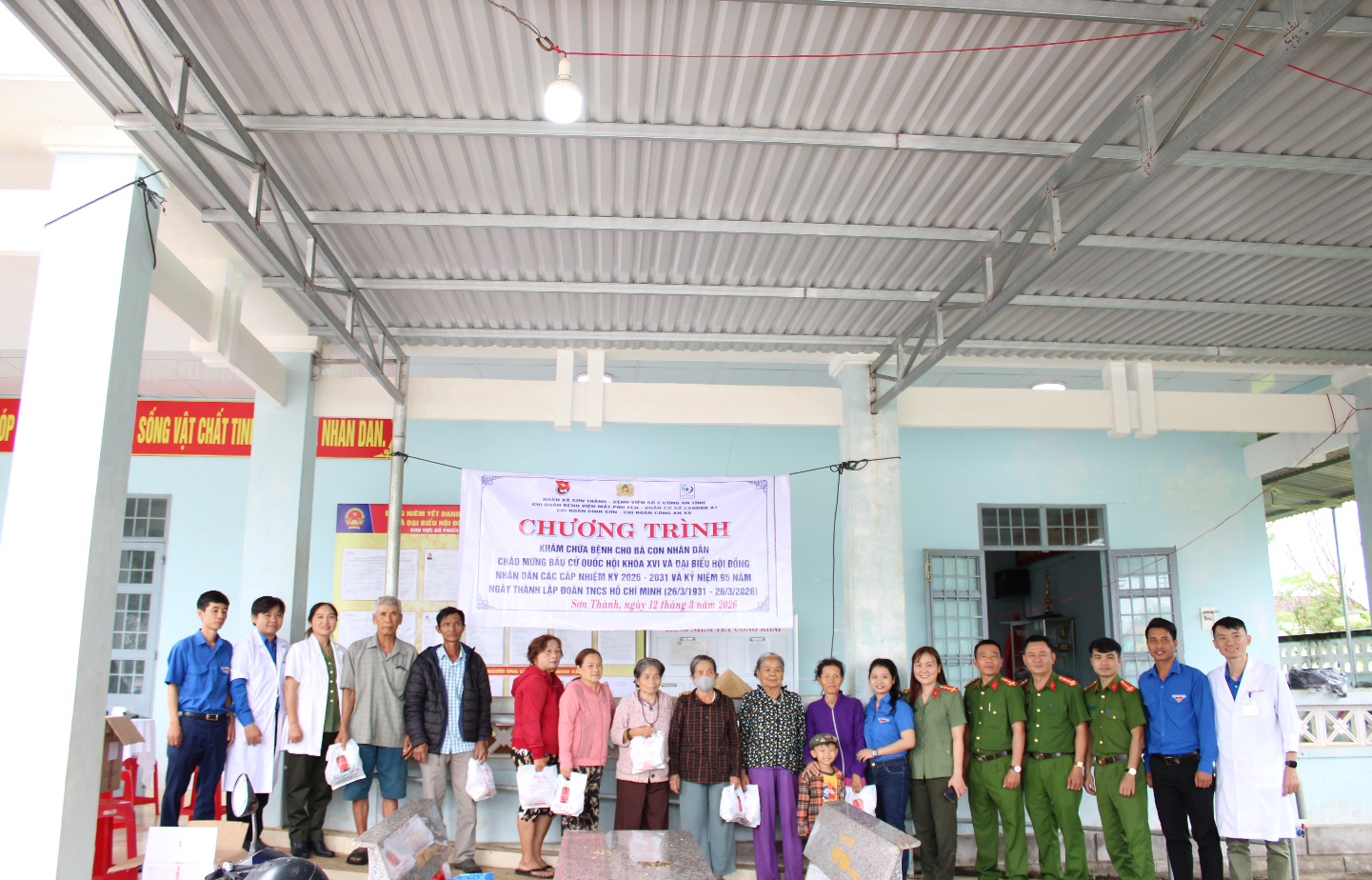 'A group of people standing in a room
 AI-generated content may be incorrect.'