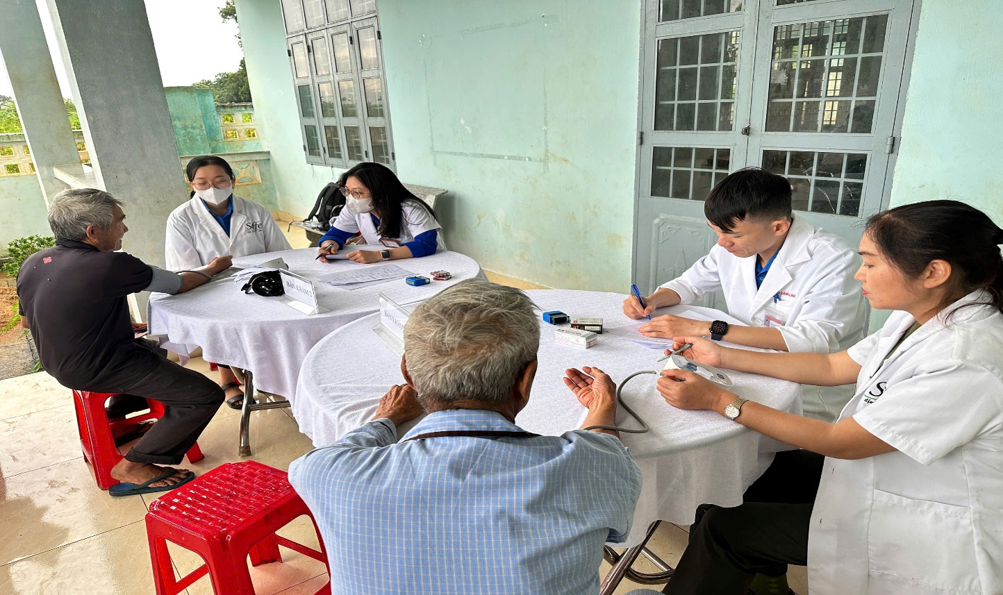 'A group of people sitting around a table
 AI-generated content may be incorrect.'