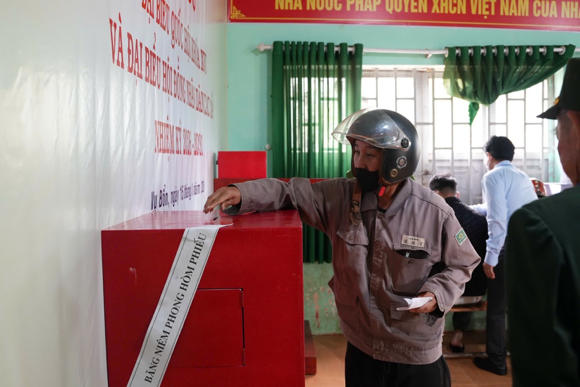 ''A person wearing a helmet and standing next to a red box
 AI-generated content may be incorrect.''