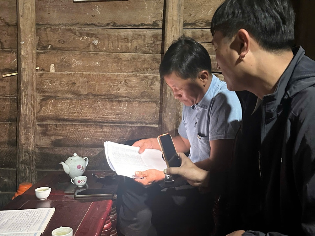 ''A couple of men looking at a paper
 AI-generated content may be incorrect.''