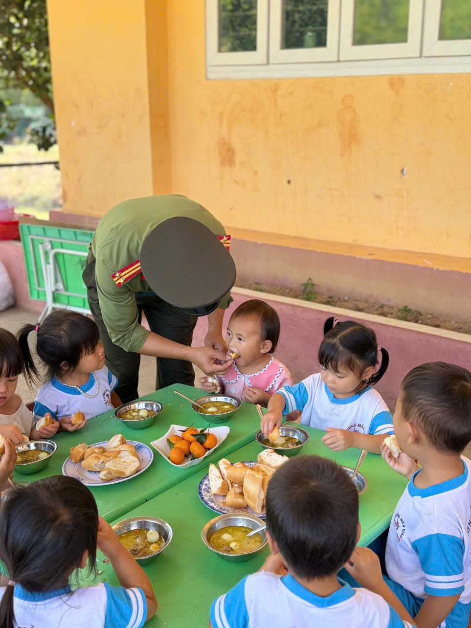 'A group of children eating at a table
AI-generated content may be incorrect.'