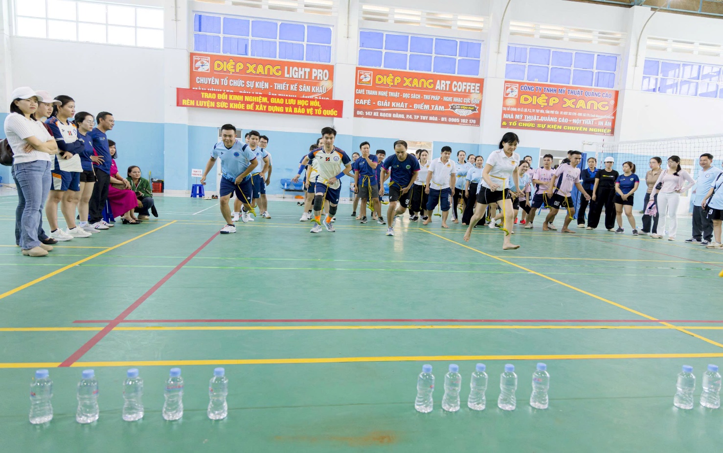 '''A group of people running in a gym

AI-generated content may be incorrect.'''