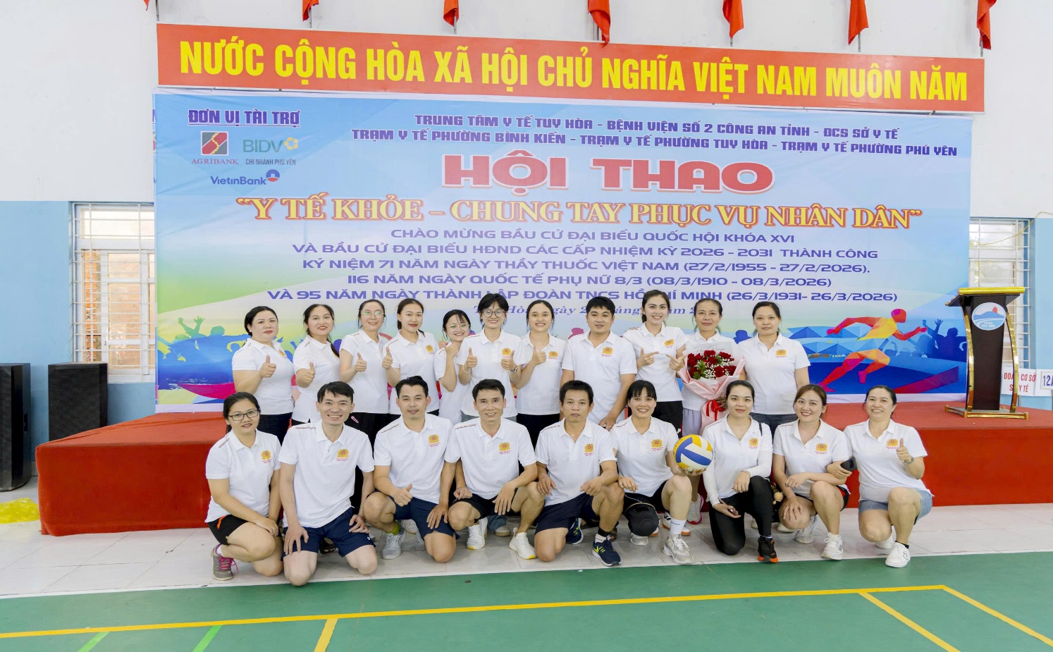 '''A group of people posing for a photo

AI-generated content may be incorrect.'''