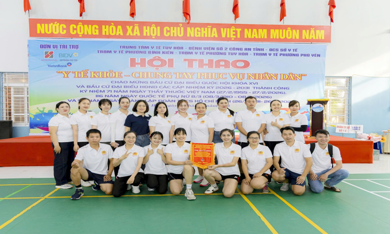 '''A group of people posing for a photo

AI-generated content may be incorrect.'''