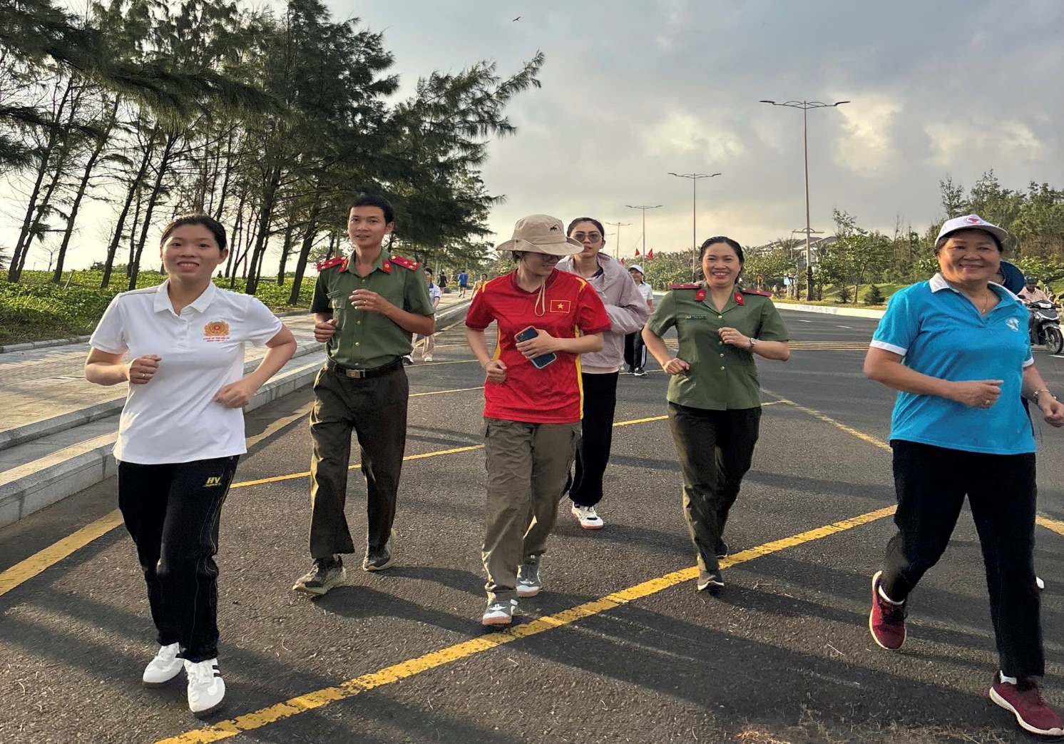 'A group of people running on a road
AI-generated content may be incorrect.'