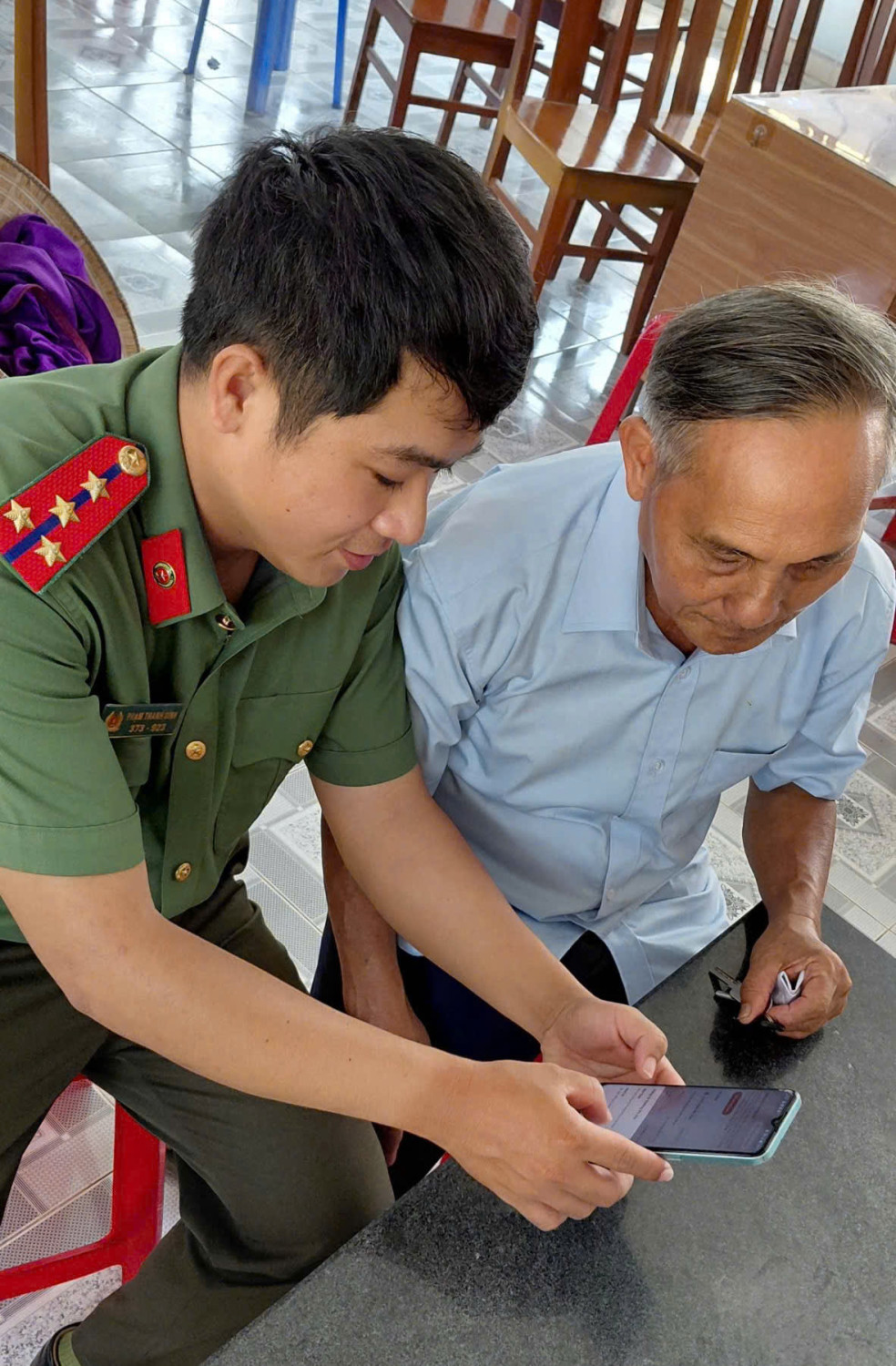 'A person in uniform looking at a tablet

AI-generated content may be incorrect.'