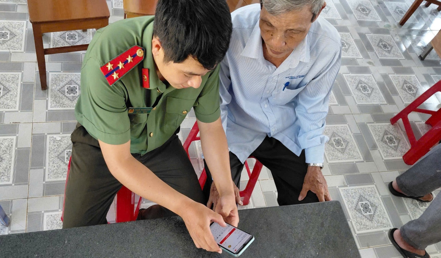 'A person in uniform looking at a phone

AI-generated content may be incorrect.'