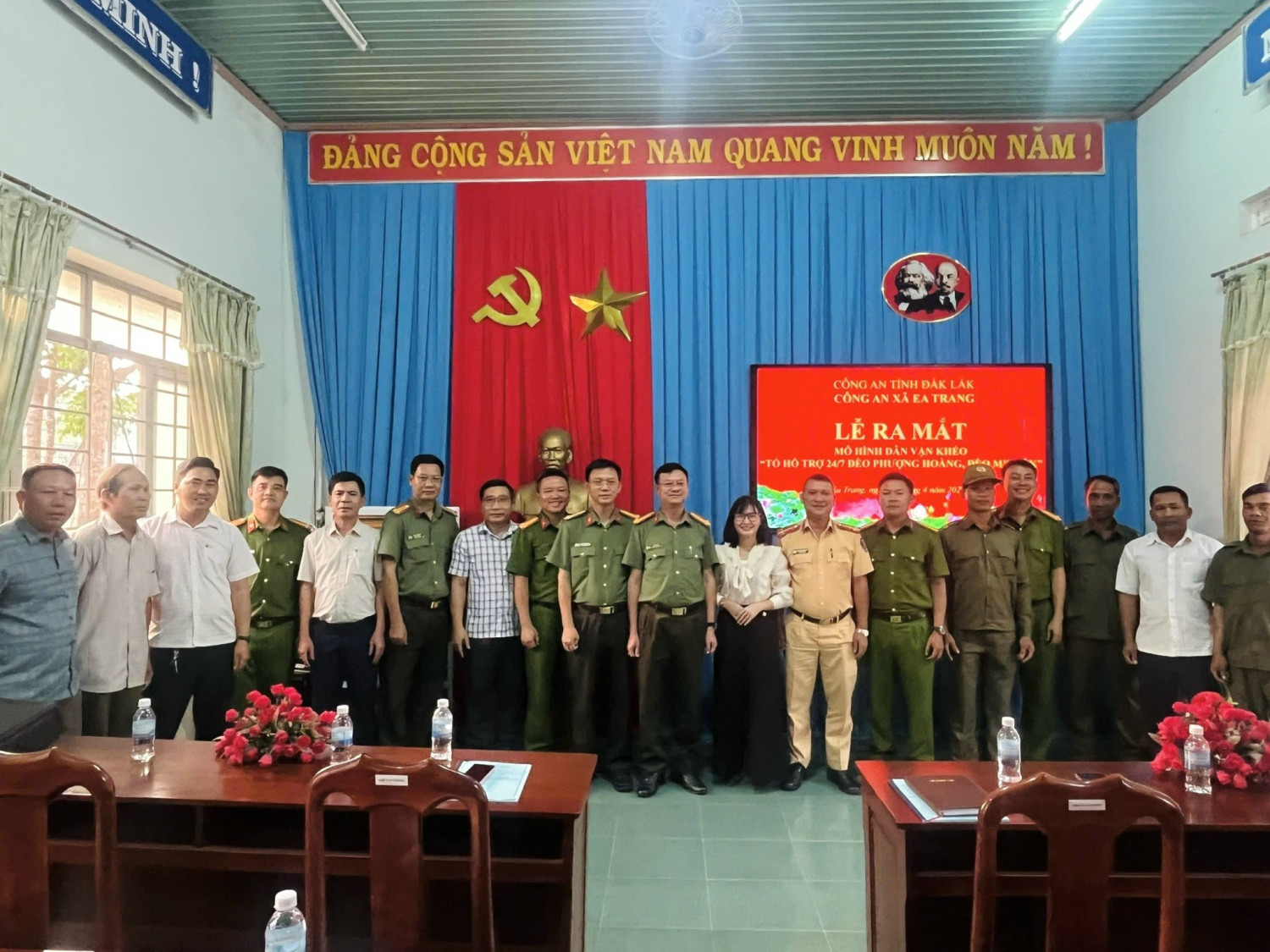 'A group of people in uniform standing in front of a flag

AI-generated content may be incorrect.'