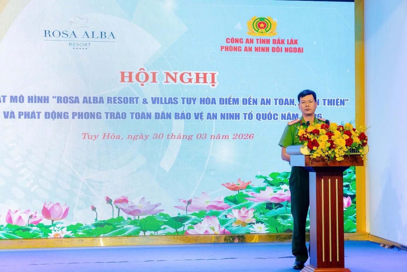 ''''''A person standing at a podium with flowers on it
 AI-generated content may be incorrect.''''''